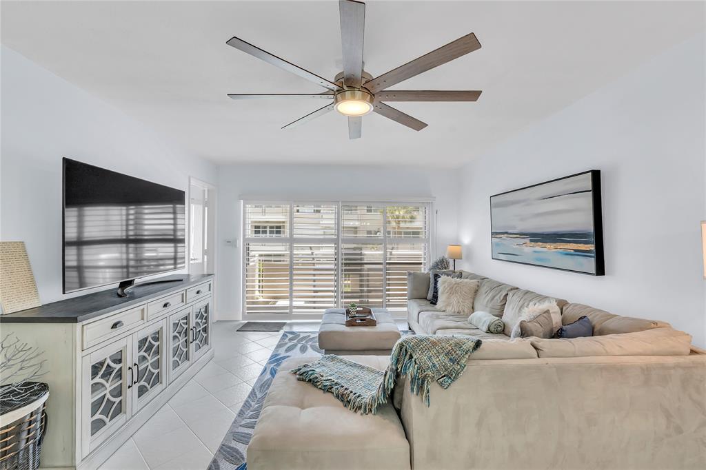 1198 Hillsboro Mile, Unit 212 Hillsboro Beach, FL 33062 - Photo 14 of 64 a bedroom with furniture and a large window