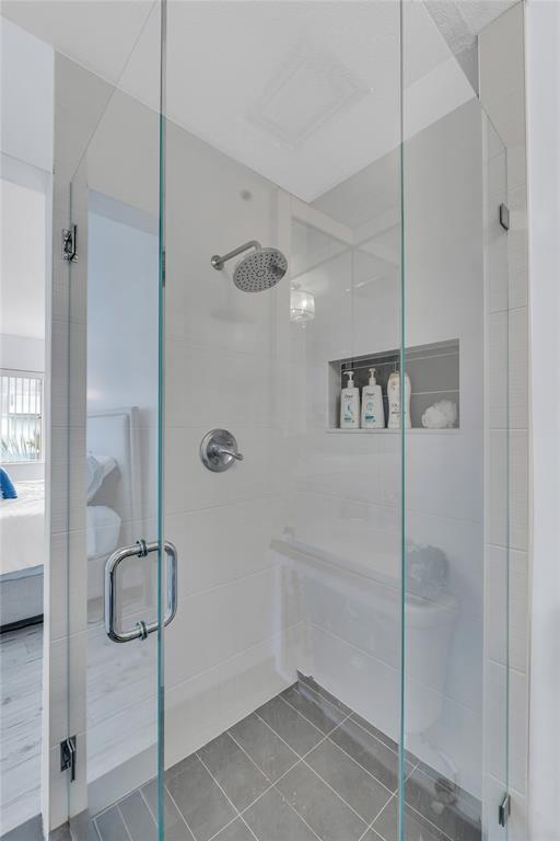 1198 Hillsboro Mile, Unit 212 Hillsboro Beach, FL 33062 - Photo 23 of 64 a bathroom with a glass shower door