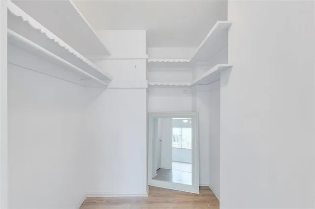 a bathroom with a sink toilet vanity and shower