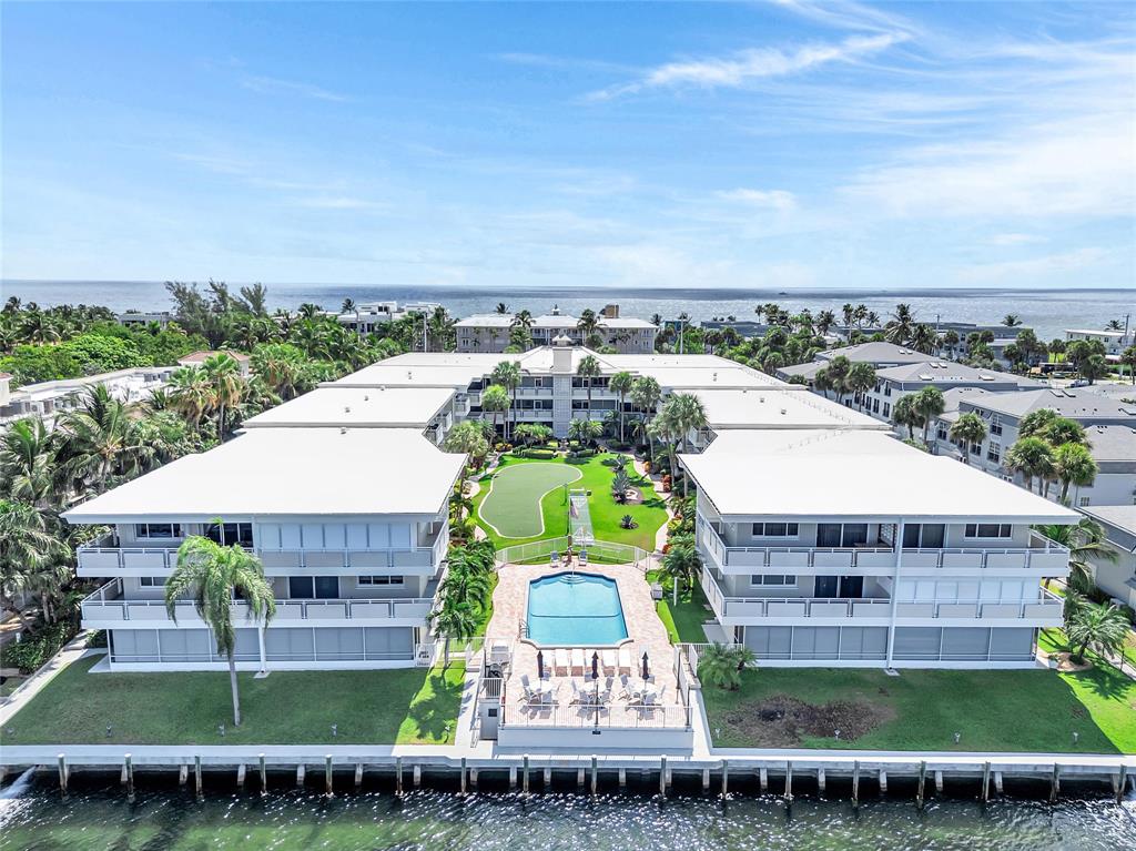 1198 Hillsboro Mile, Unit 212 Hillsboro Beach, FL 33062 - Photo 3 of 64 an aerial view of a house with a garden