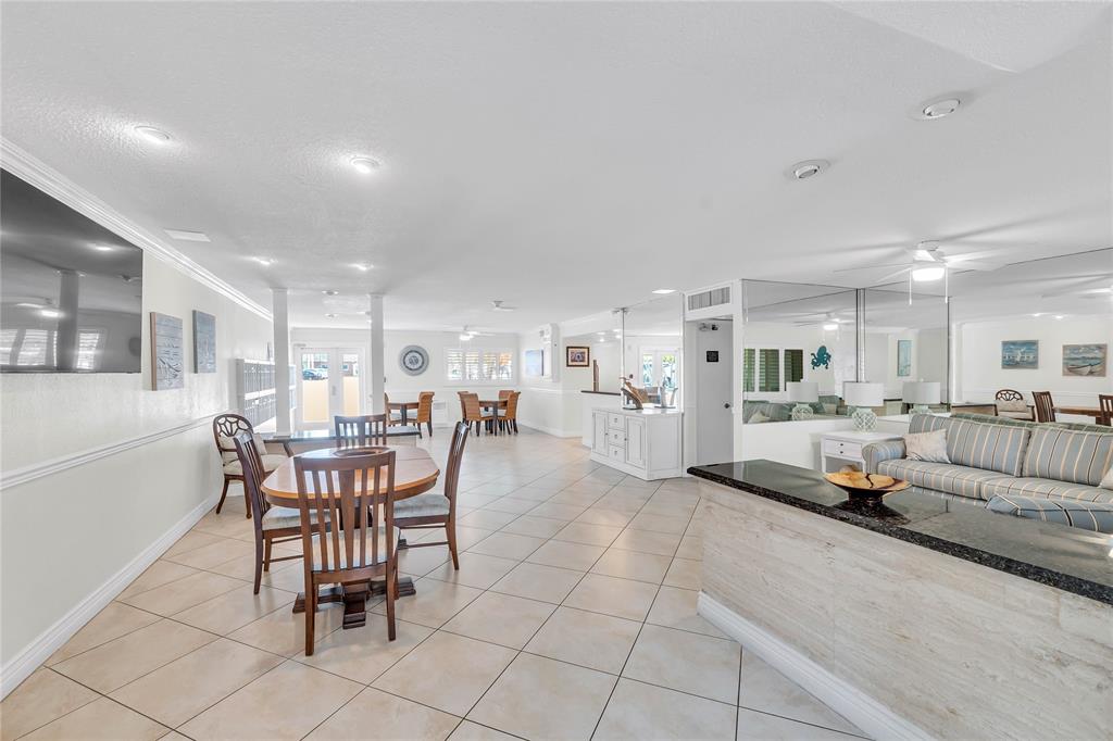 1198 Hillsboro Mile, Unit 212 Hillsboro Beach, FL 33062 - Photo 39 of 64 a living room with furniture and a table