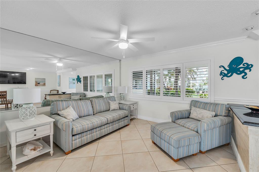 1198 Hillsboro Mile, Unit 212 Hillsboro Beach, FL 33062 - Photo 40 of 64 a living room with furniture and a large window