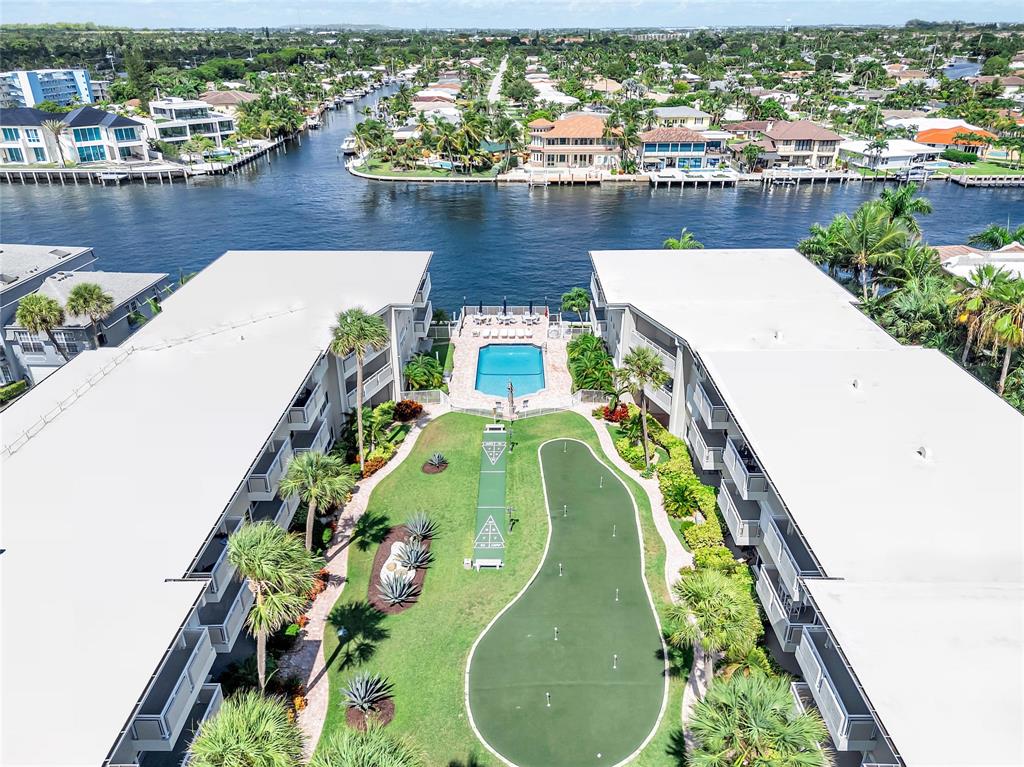 1198 Hillsboro Mile, Unit 212 Hillsboro Beach, FL 33062 - Photo 48 of 64 an aerial view of a house with a swimming pool