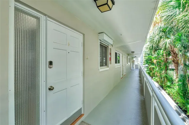 a view of a porch with wooden floor and stairs