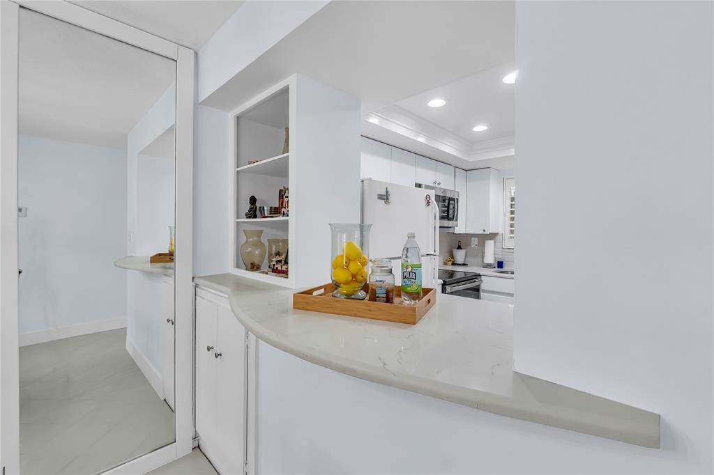 1198 Hillsboro Mile, Unit 212 Hillsboro Beach, FL 33062 - Photo 10 of 64 a view of living room with furniture and lamp