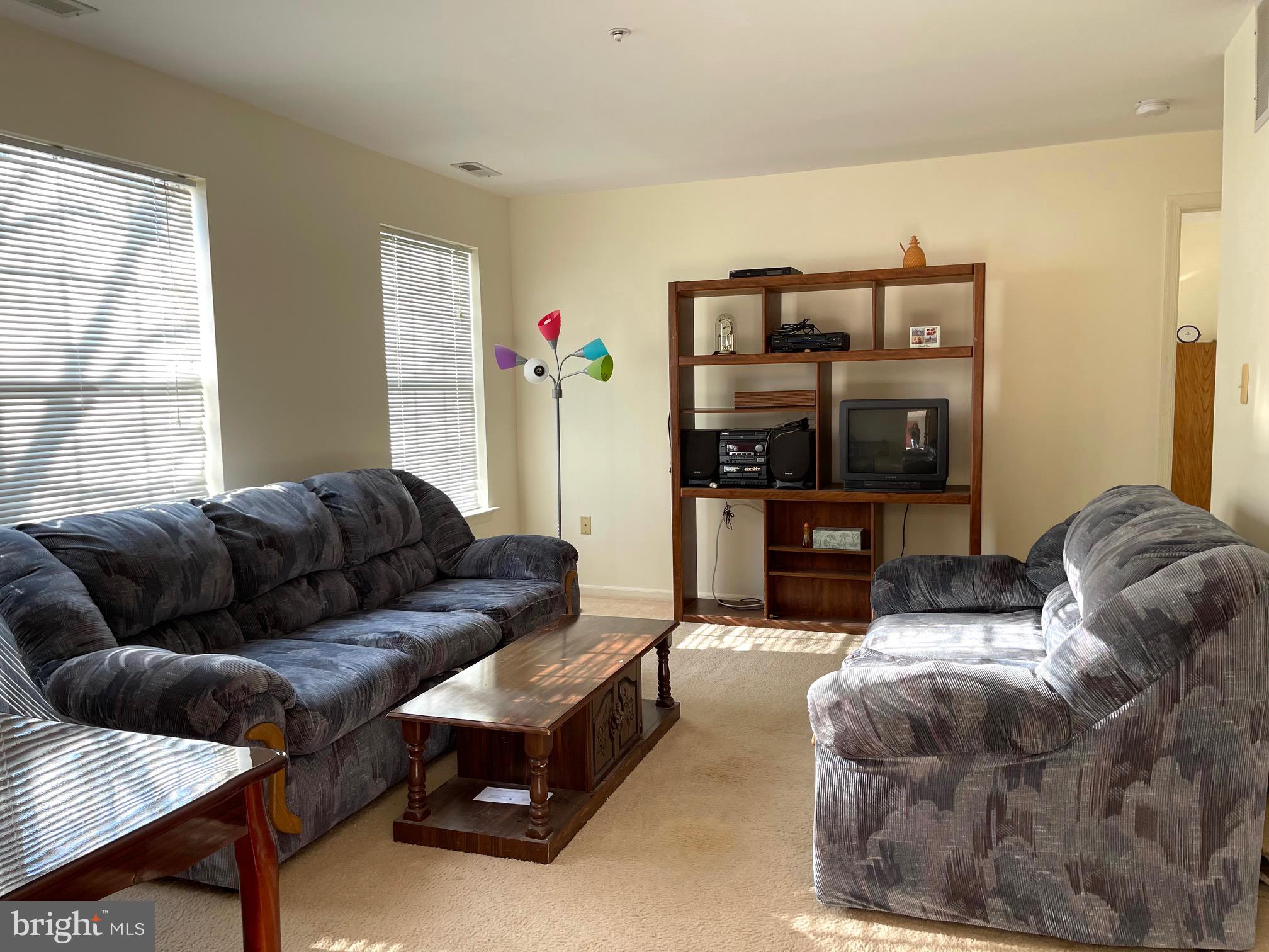 414 Brickhouse Road Princeton, NJ 08540 - Photo 3 of 9 a living room with furniture and a fireplace