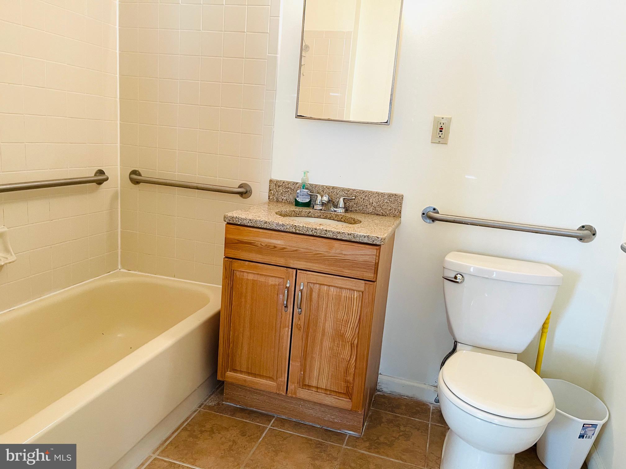 414 Brickhouse Road Princeton, NJ 08540 - Photo 8 of 9 a bathroom with a granite countertop toilet a sink and bathtub