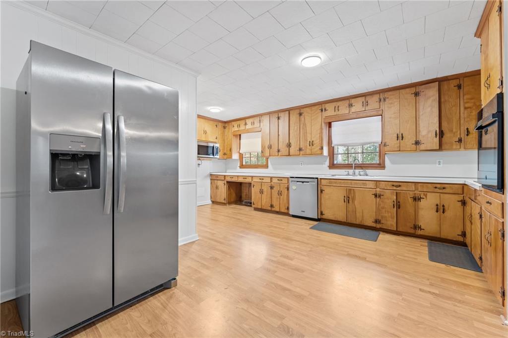 217 Lambert Road Biscoe, NC 27209 - Photo 6 of 28 Kitchen has updated Stainless Steel refrigerator, microwave and dishwasher.