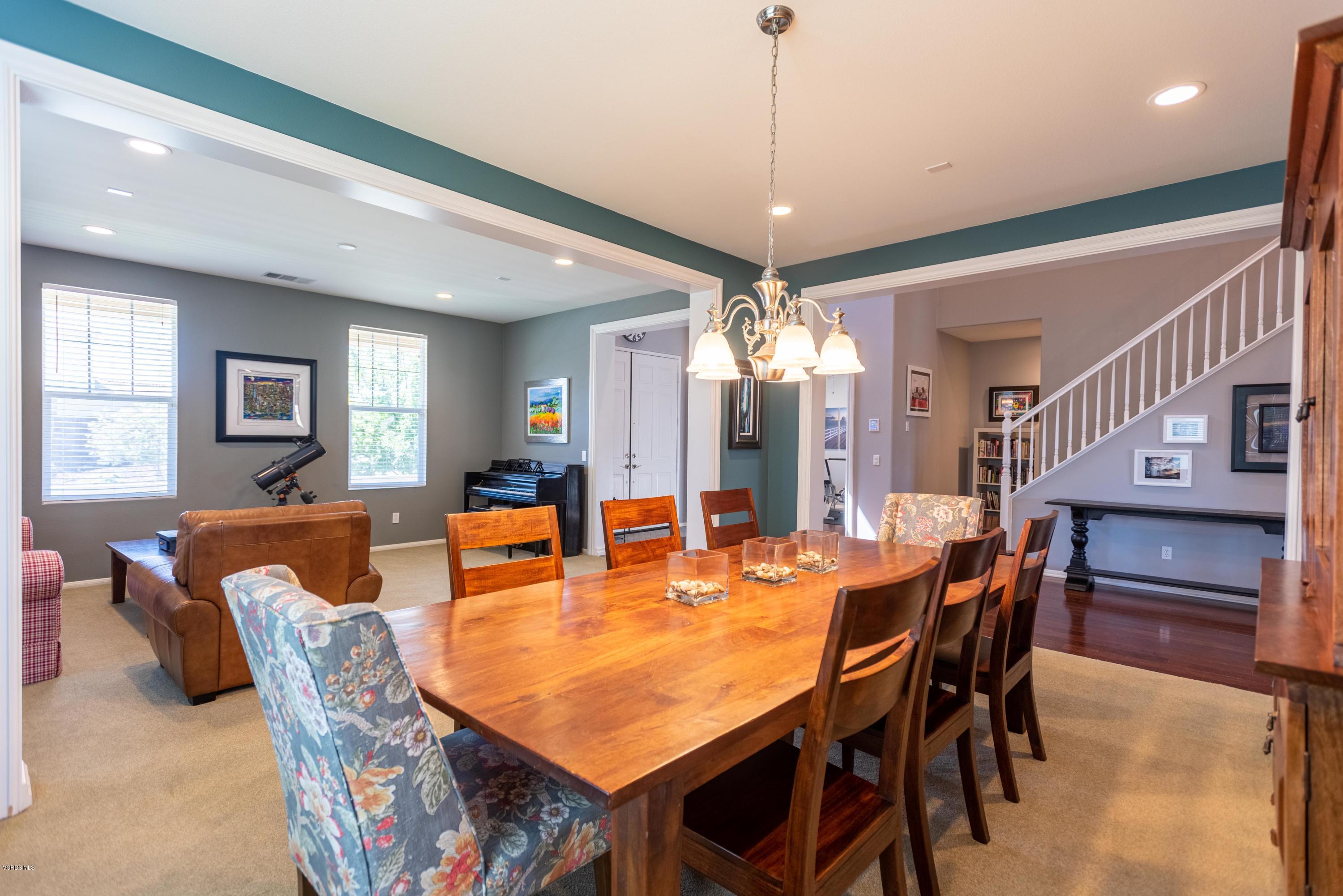 17118 Raindrop Court Riverside, CA 92503 - Photo 12 of 68 a dining room with furniture a chandelier and window