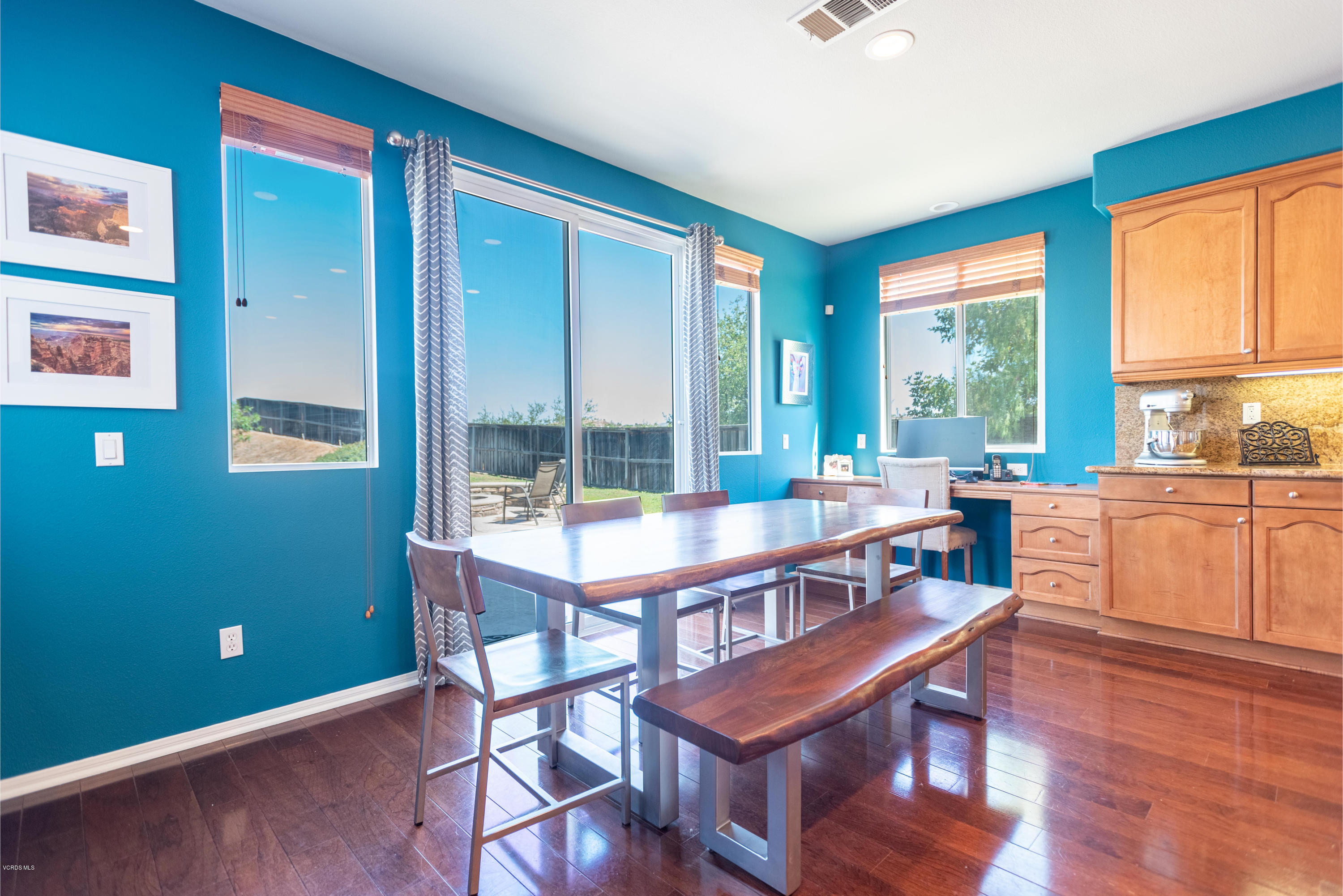 17118 Raindrop Court Riverside, CA 92503 - Photo 20 of 68 a view of a dining room with furniture large windows and wooden floor