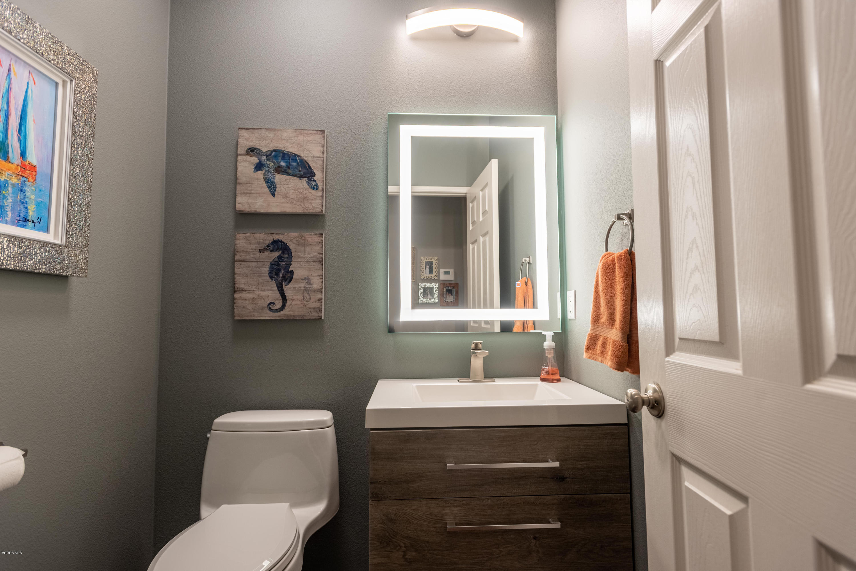 17118 Raindrop Court Riverside, CA 92503 - Photo 29 of 68 a bathroom with a toilet sink and mirror