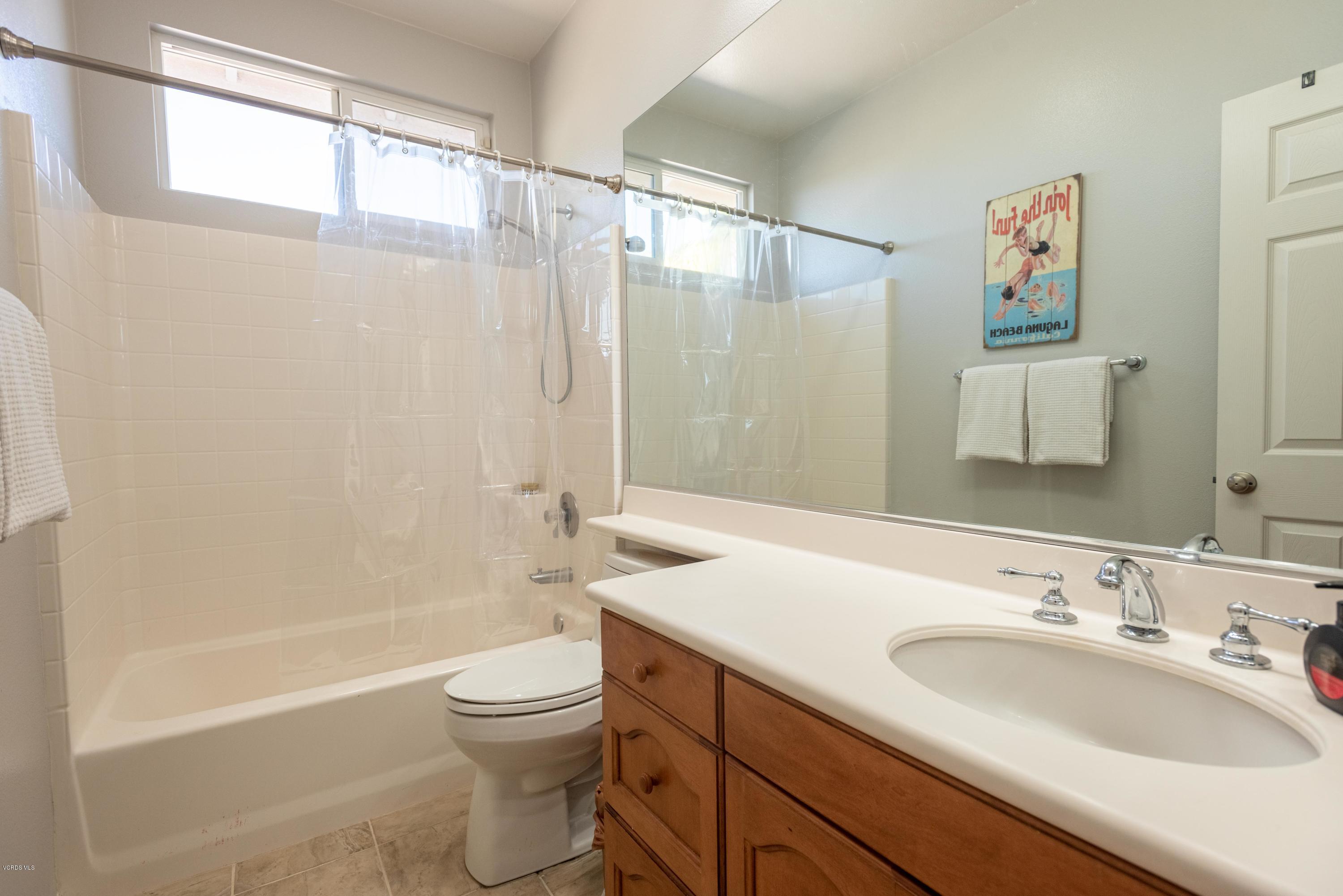 17118 Raindrop Court Riverside, CA 92503 - Photo 32 of 68 a bathroom with a sink a toilet and a bathtub