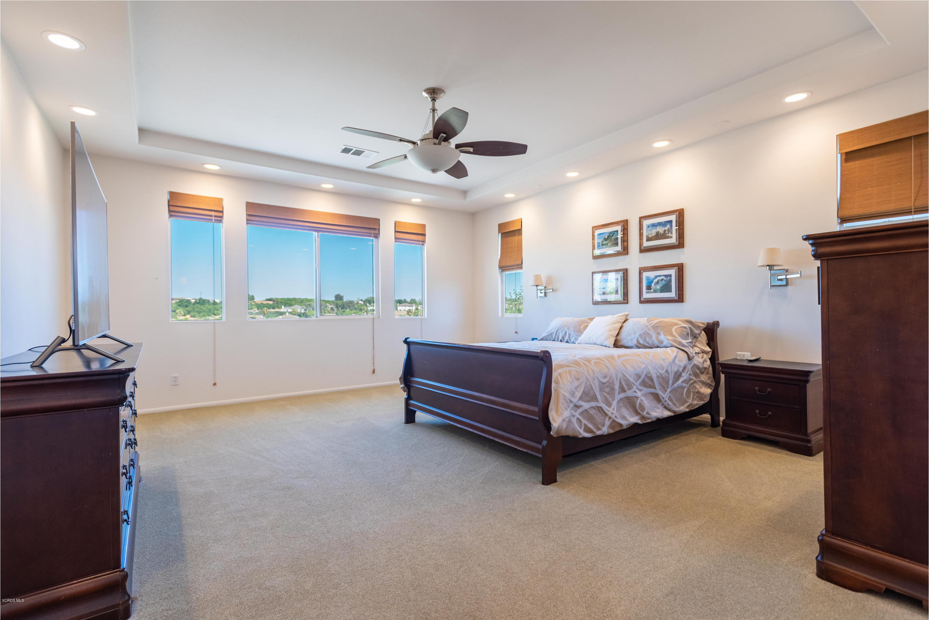 17118 Raindrop Court Riverside, CA 92503 - Photo 37 of 68 a bedroom with a bed and a chandelier