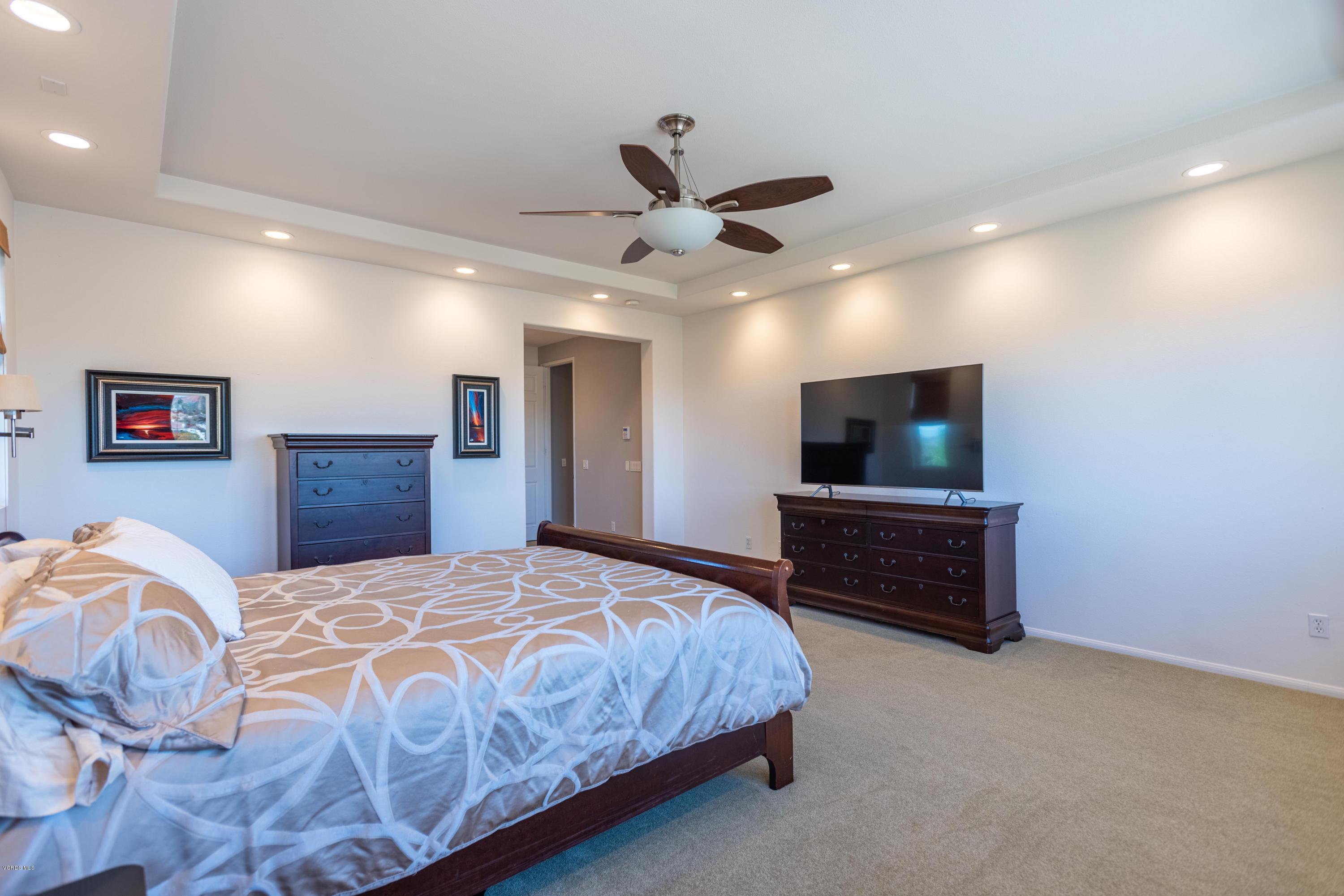 17118 Raindrop Court Riverside, CA 92503 - Photo 38 of 68 a bedroom with a bed and a flat screen tv