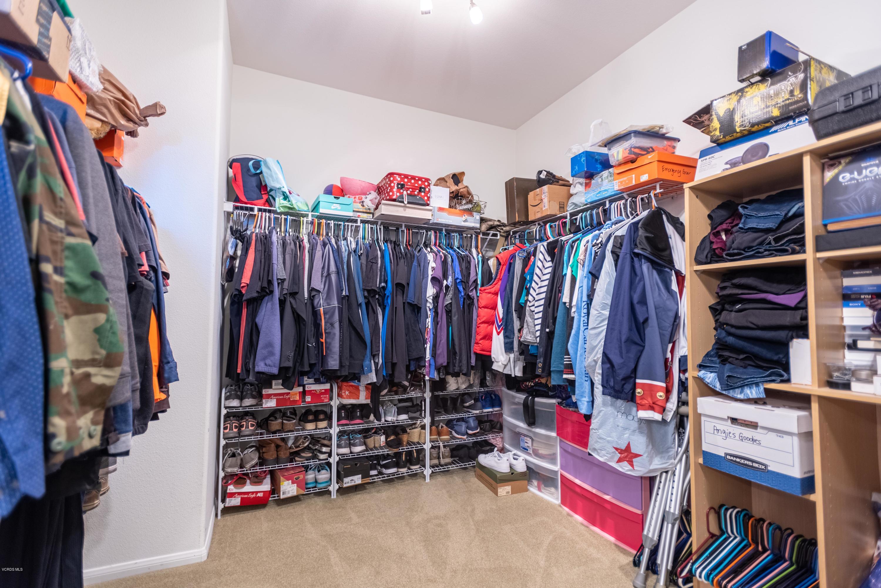17118 Raindrop Court Riverside, CA 92503 - Photo 46 of 68 a view of walk in closet with clothes