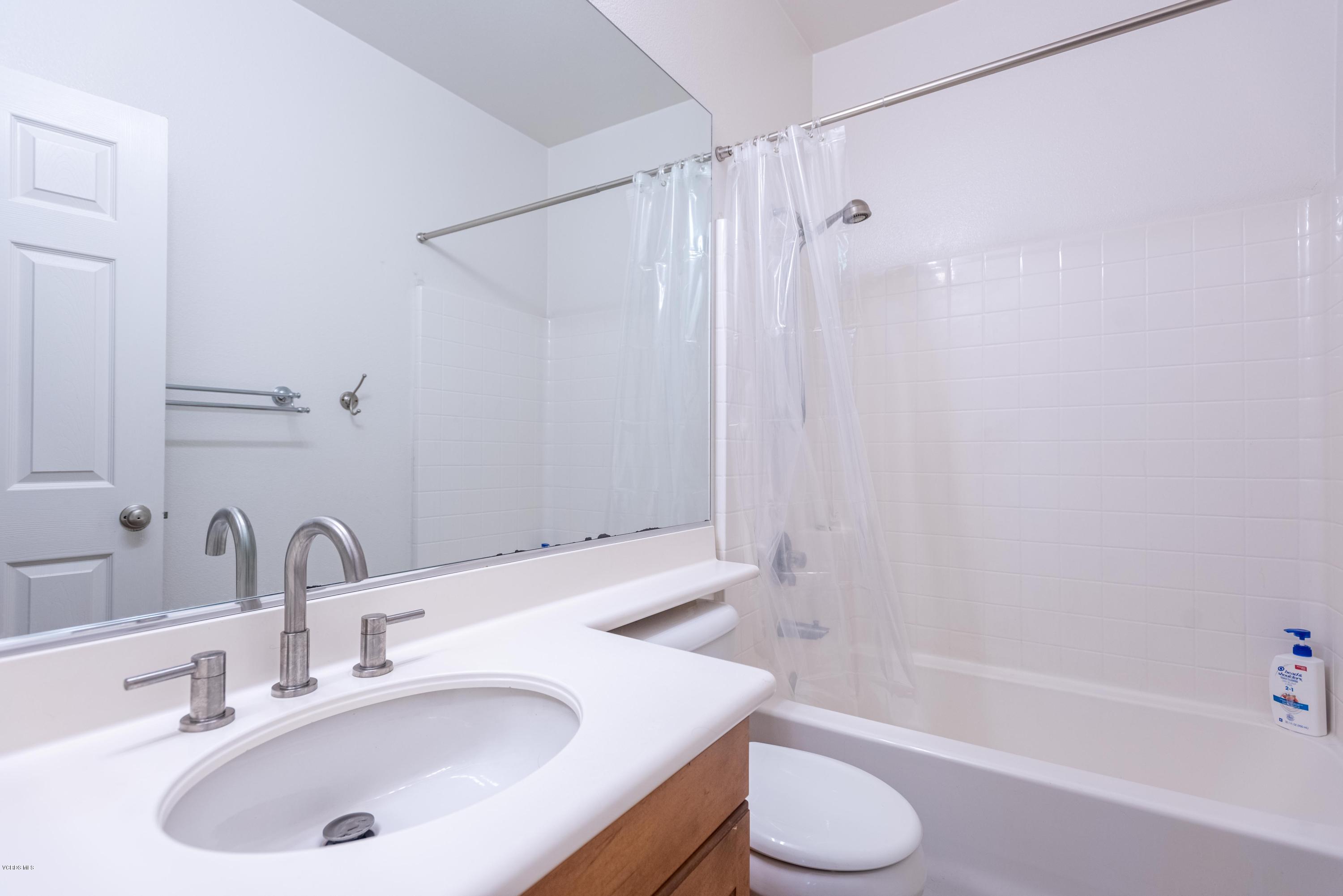 17118 Raindrop Court Riverside, CA 92503 - Photo 49 of 68 a bathroom with a sink toilet and shower