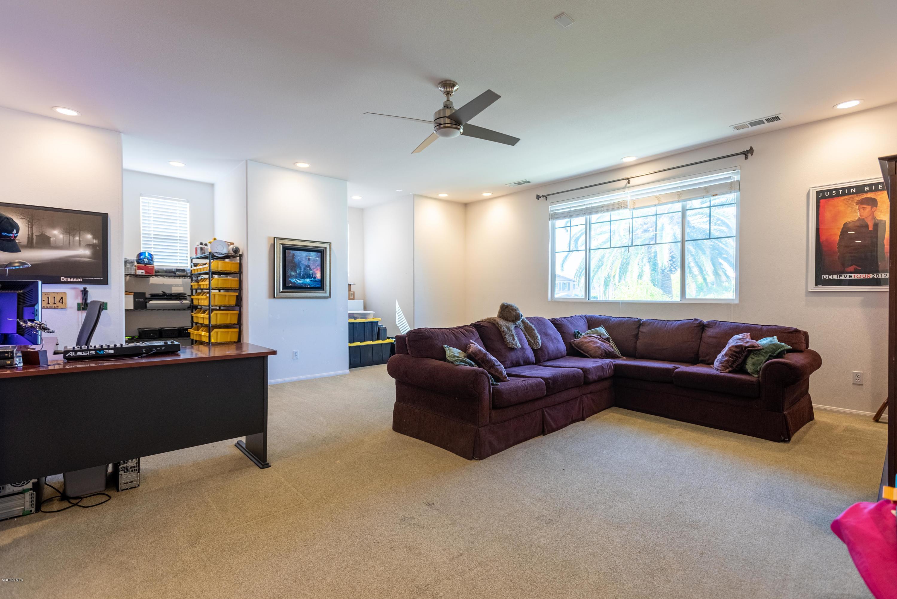 17118 Raindrop Court Riverside, CA 92503 - Photo 51 of 68 a living room with furniture and a flat screen tv