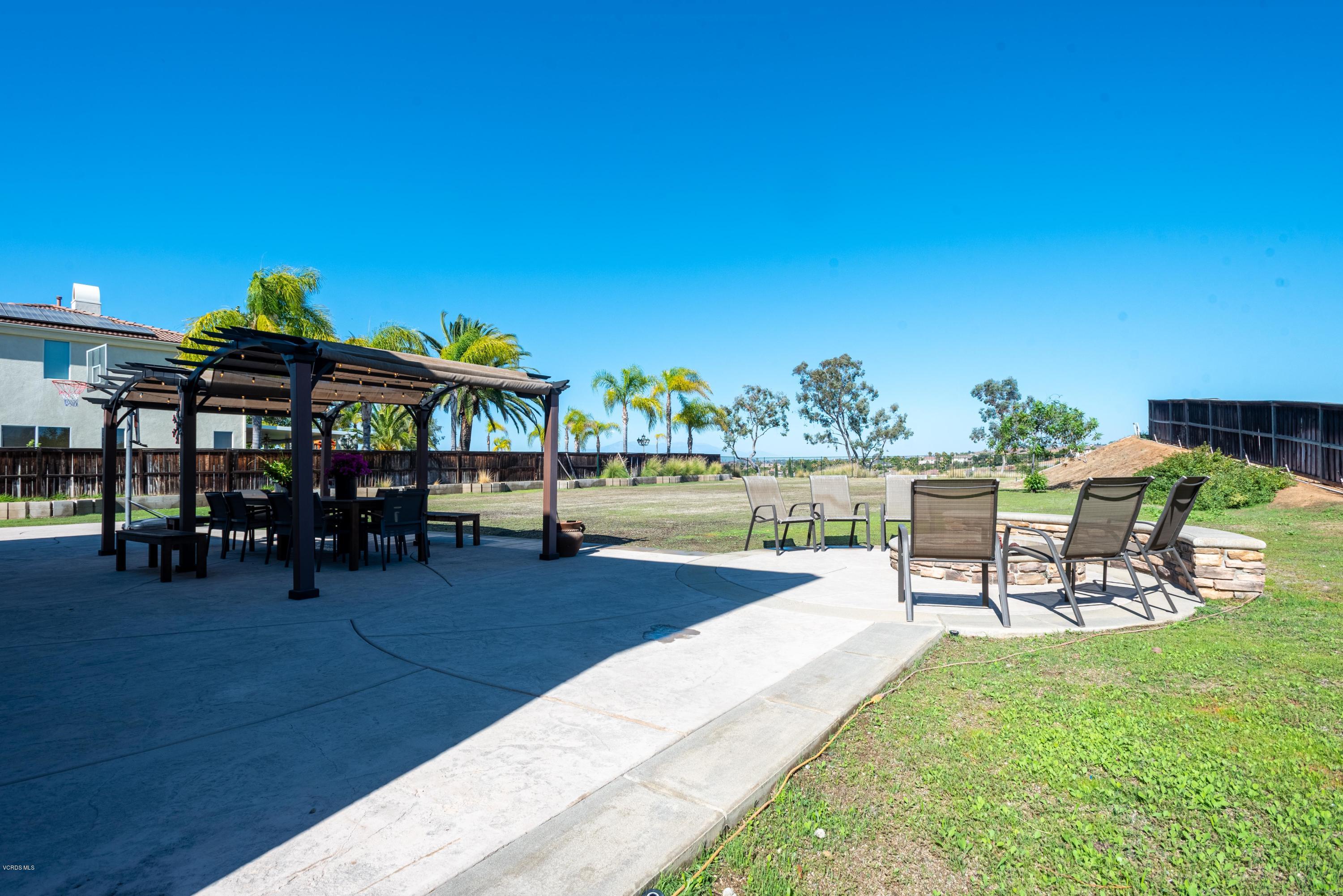 17118 Raindrop Court Riverside, CA 92503 - Photo 55 of 68 a view of a swimming pool with lawn chairs and couches