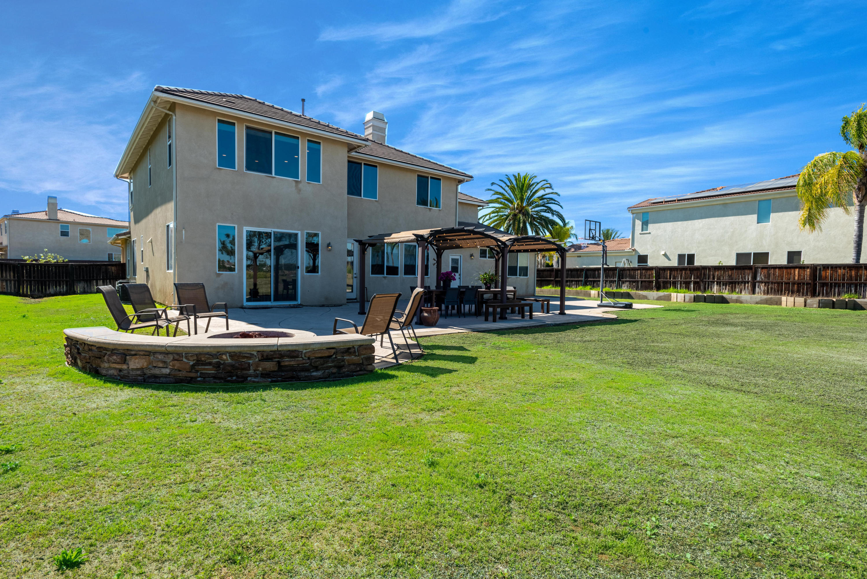 17118 Raindrop Court Riverside, CA 92503 - Photo 63 of 68 a front view of a house with a garden and sitting area