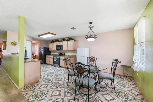 a view of a dining room with furniture