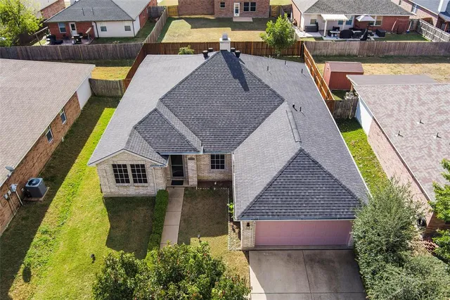 an aerial view of a house with swimming pool
