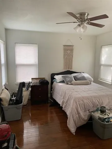 a bedroom with a bed and a couch