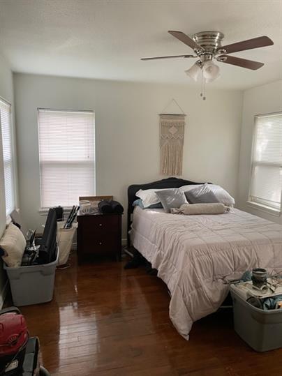 2014 49th Street Lubbock, TX 79412 - Photo 7 of 16 a bedroom with a bed and a couch