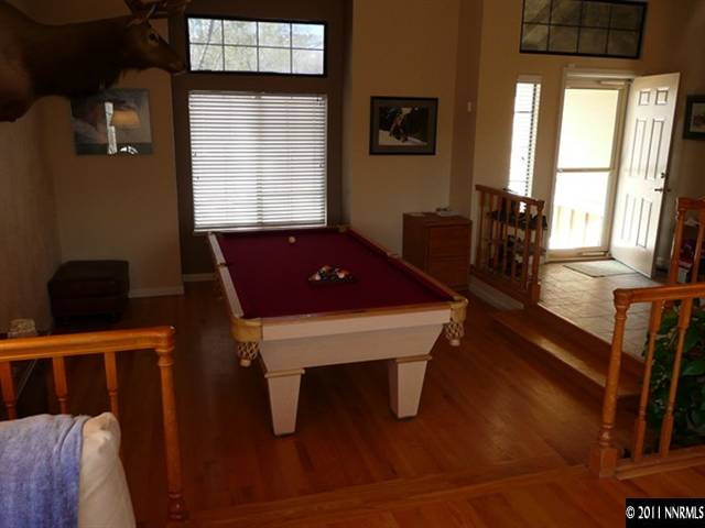5738 Simons Drive Reno, NV 89523 - Photo 3 of 13 a room with furniture pool table and windows
