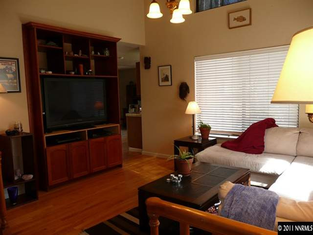 5738 Simons Drive Reno, NV 89523 - Photo 4 of 13 a living room with furniture and a flat screen tv