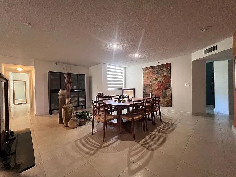 6463 La Costa Drive, Unit 105 Boca Raton, FL 33433 - Photo 10 of 40 a view of a dining room with furniture window and wooden floor