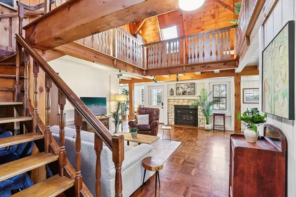 a view of entryway dining room and hall with wooden floor