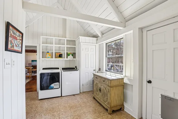 a kitchen with cabinets and a stove