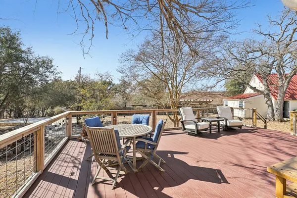 a patio with a table and chairs
