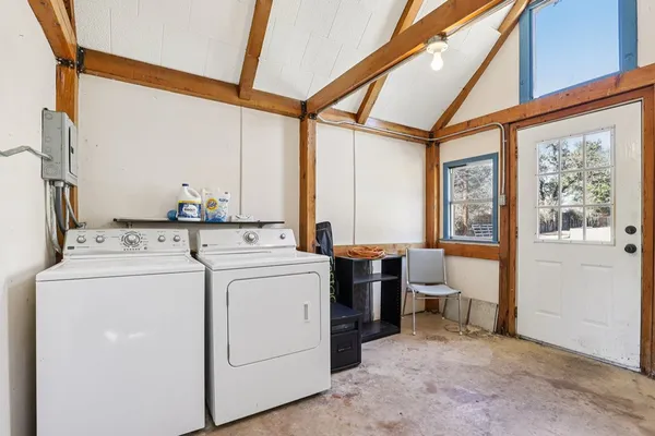 a view of a garage with wooden floors