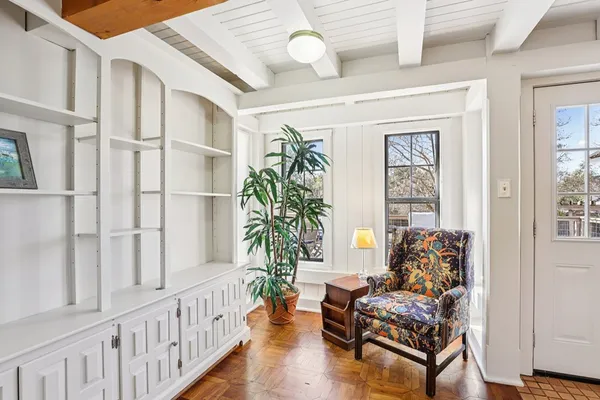 a living room with furniture and a window