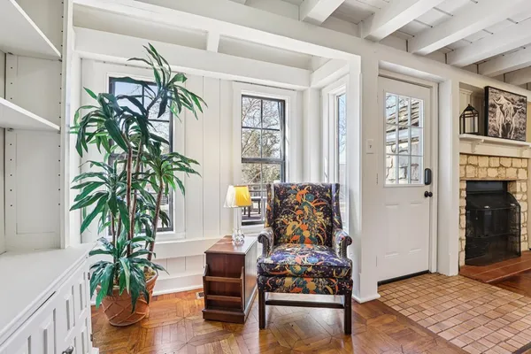 a living room with furniture and a potted plant