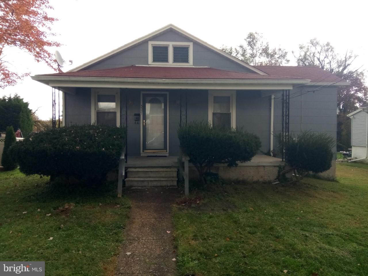 3321 Fairview Road Baltimore, MD 21207 - Photo 1 of 12 a front view of a house with garden