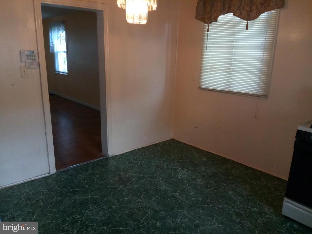 3321 Fairview Road Baltimore, MD 21207 - Photo 9 of 12 a view of an empty room with a window