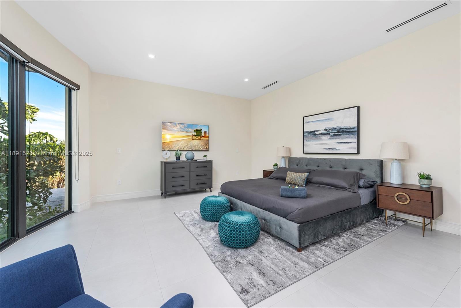 6529 Southwest 30th Street Miami, FL 33155 - Photo 11 of 45 a living room with furniture and a flat screen tv