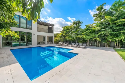 a view of a house with swimming pool