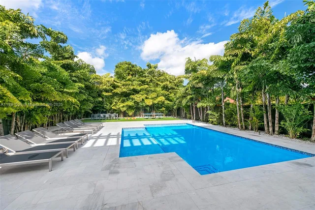 a view of swimming pool with lounge chair