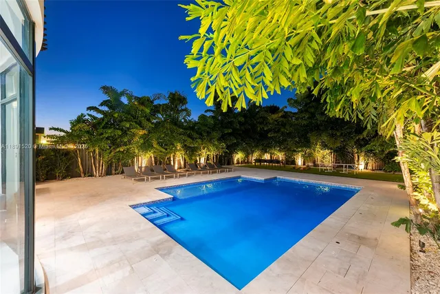 a view of swimming pool with a patio