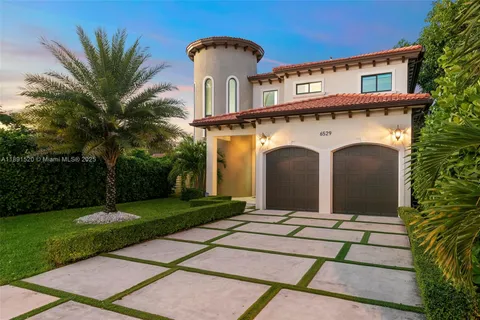 a front view of a house with yard