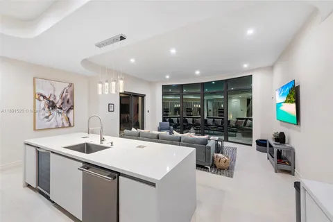 a kitchen with a sink appliances and a counter top space