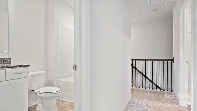 a bathroom with a toilet and a sink