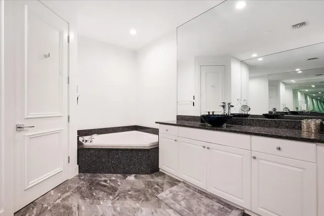 a bathroom with a sink and a bathtub