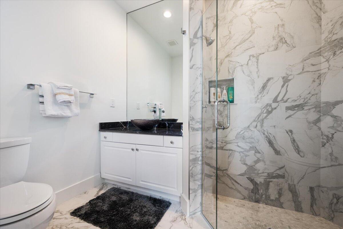 2514 Players Court Wellington, FL 33414 - Photo 18 of 30 a bathroom with a sink toilet and shower