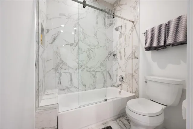 a bedroom with a bed and a walk in closet