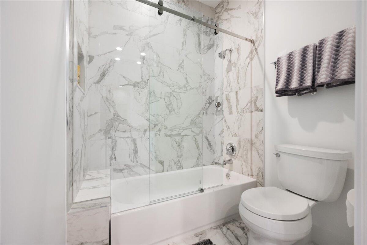 2514 Players Court Wellington, FL 33414 - Photo 23 of 30 a bathroom with a toilet and a shower