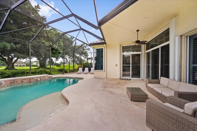 a view of a white house with swimming pool in front of it